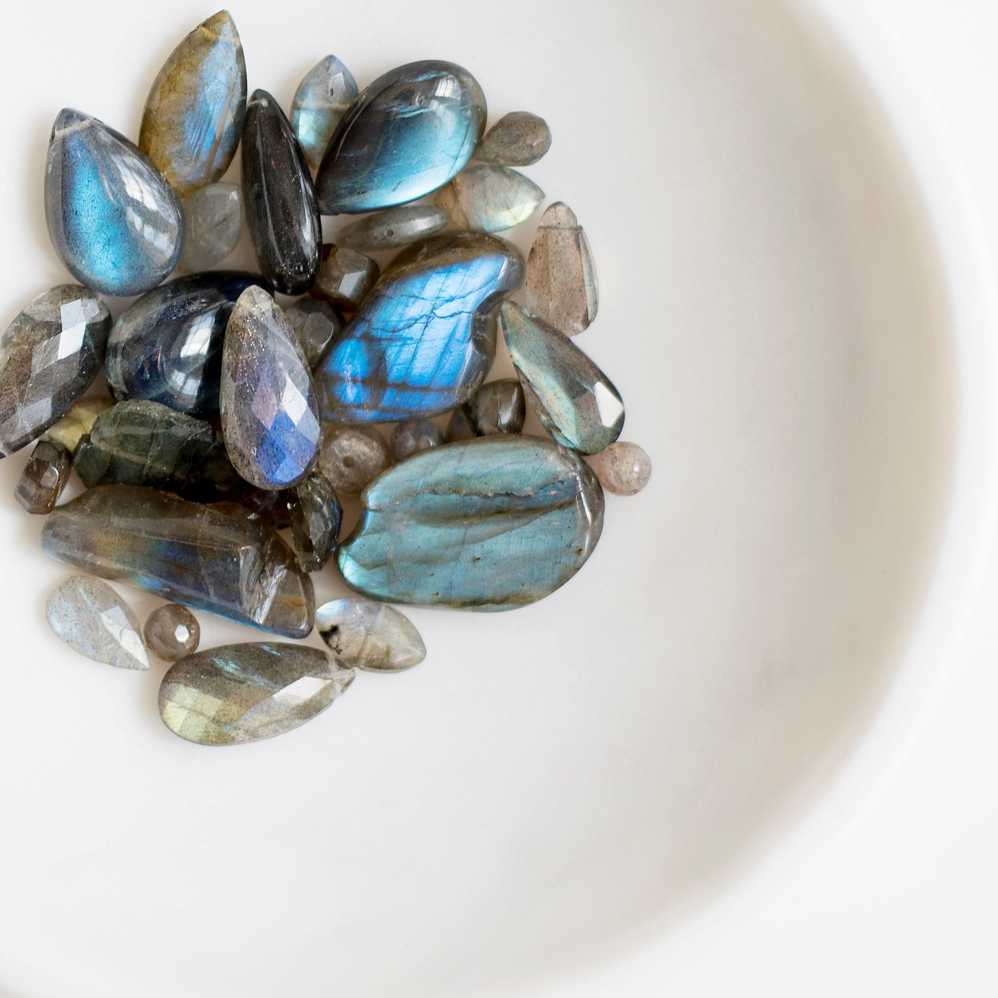Labradorite True to its origins in the northern Canadian wilderness of Labrador, this stone entrances admirers with the deep blues, brilliant aquas, flashing greens, and golds of the Aurora Borealis. Its ever-shifting colors make labradorite well-known as