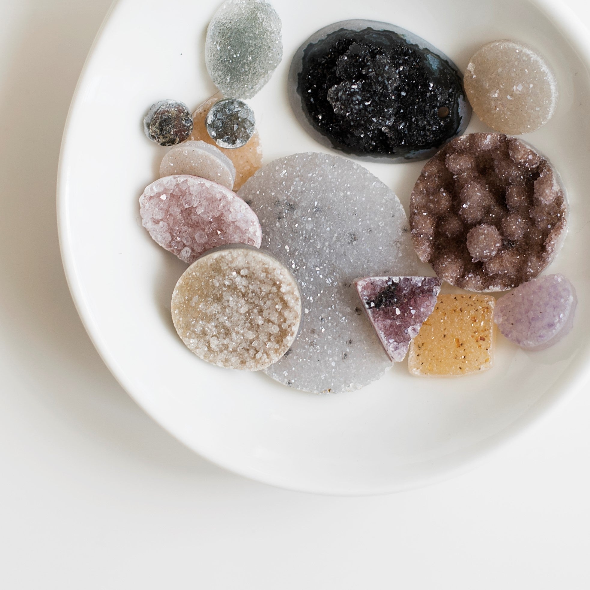 Formed over millennia, the tiny, glittering crystals that make up druzy grow from mineral-rich water trapped in pockets of rock. The resulting plates of druzy occur naturally in an incredible range of colors and sizes, and are often cut for jewelry or har
