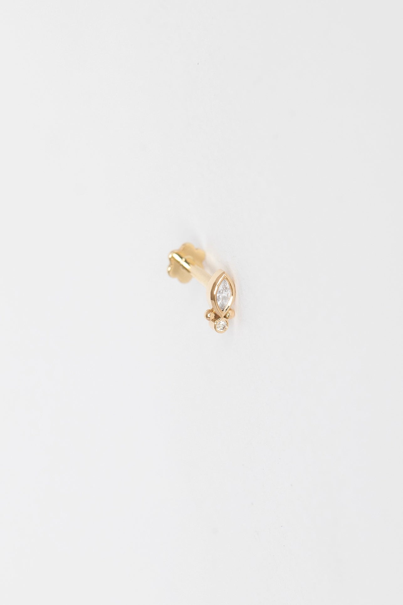 Diamond marquise flatback stud in 14k yellow gold by Celine Daoust.