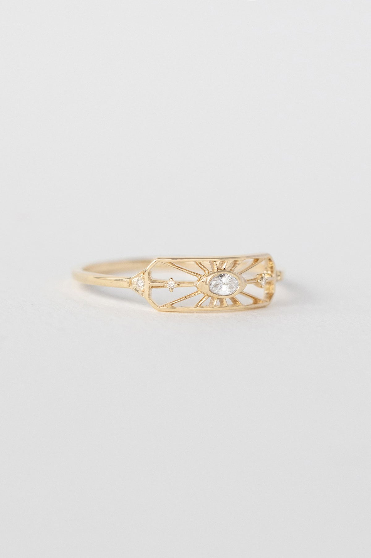 Close-up of dream maker open eye octagonal ring in 14k gold, set with diamonds.