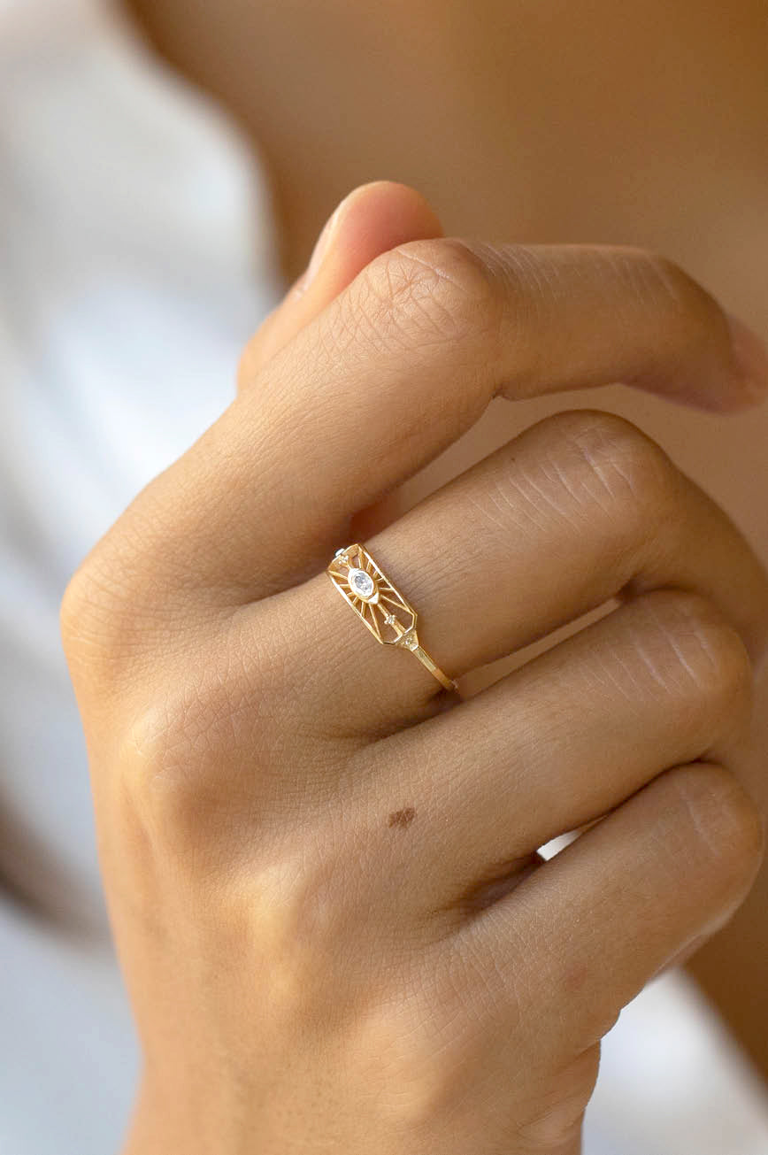 Dream maker open eye ring in 14k light yellow gold with an oval diamond by Celine Daoust.