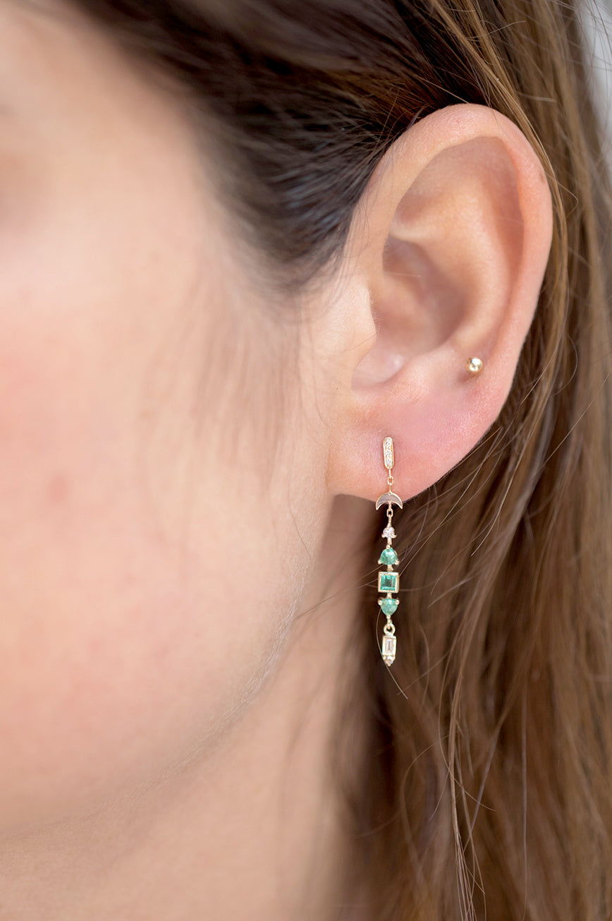Totem earrings in 14k yellow gold with square and triangle emeralds and diamonds by Celine Daoust.