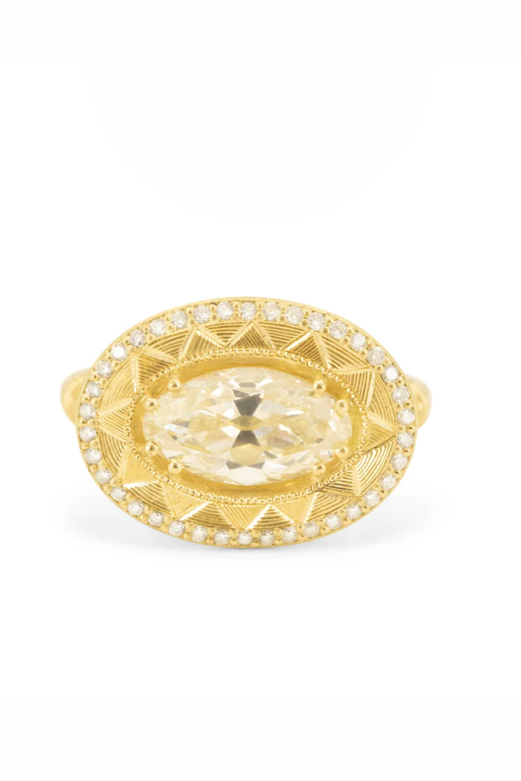 Soleil Levant pedestal solitaire ring in 18k gold with an oval diamond by Erin Cuff.