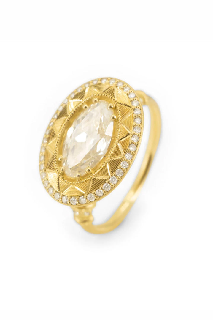 Soleil Levant pedestal solitaire ring in 18k gold with an oval diamond by Erin Cuff.