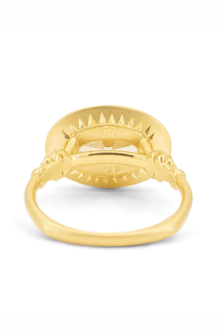 Soleil Levant pedestal solitaire ring in 18k gold with an oval diamond by Erin Cuff.