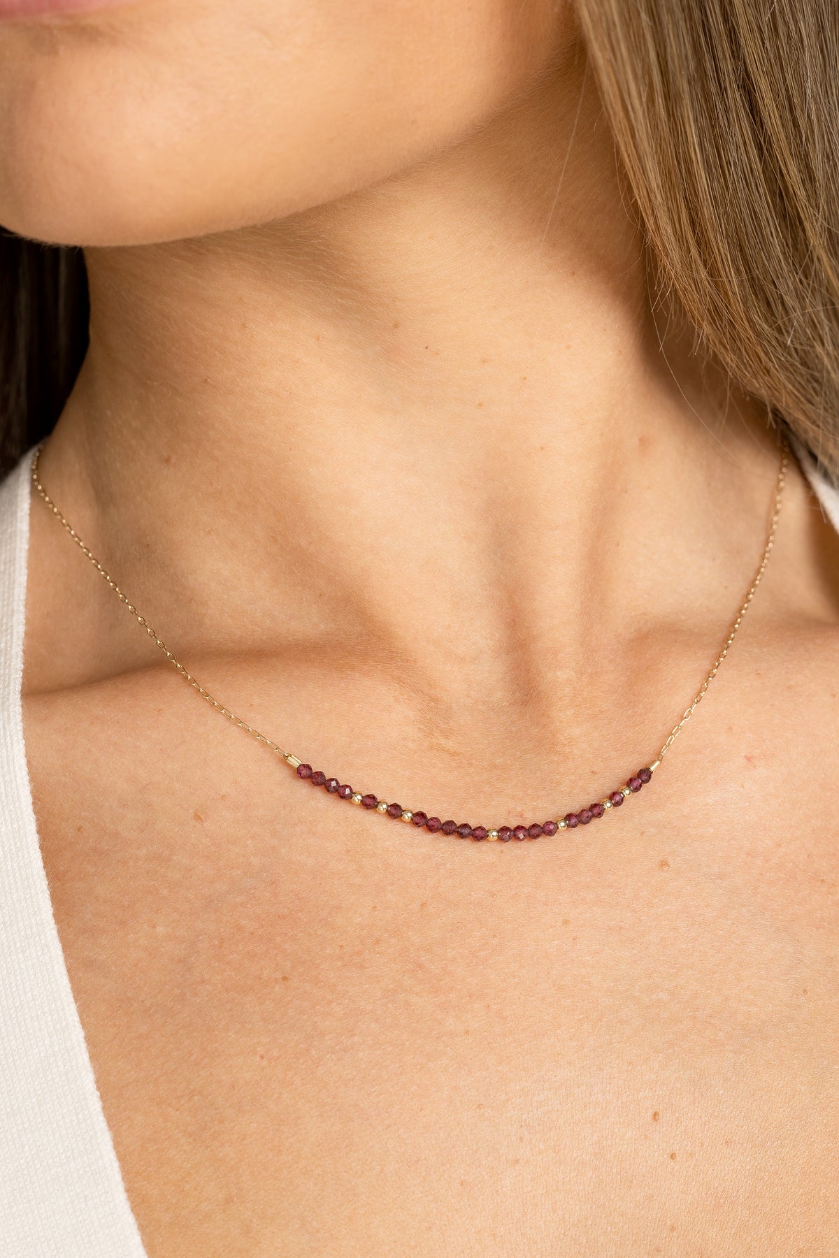 January birthstone bar necklace with garnet beads on a gold filled chain.