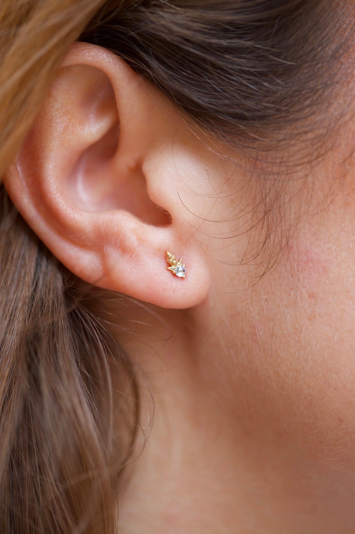 Rainbow moonstone single earring in 14k yellow gold with dot details by Celine Daoust.