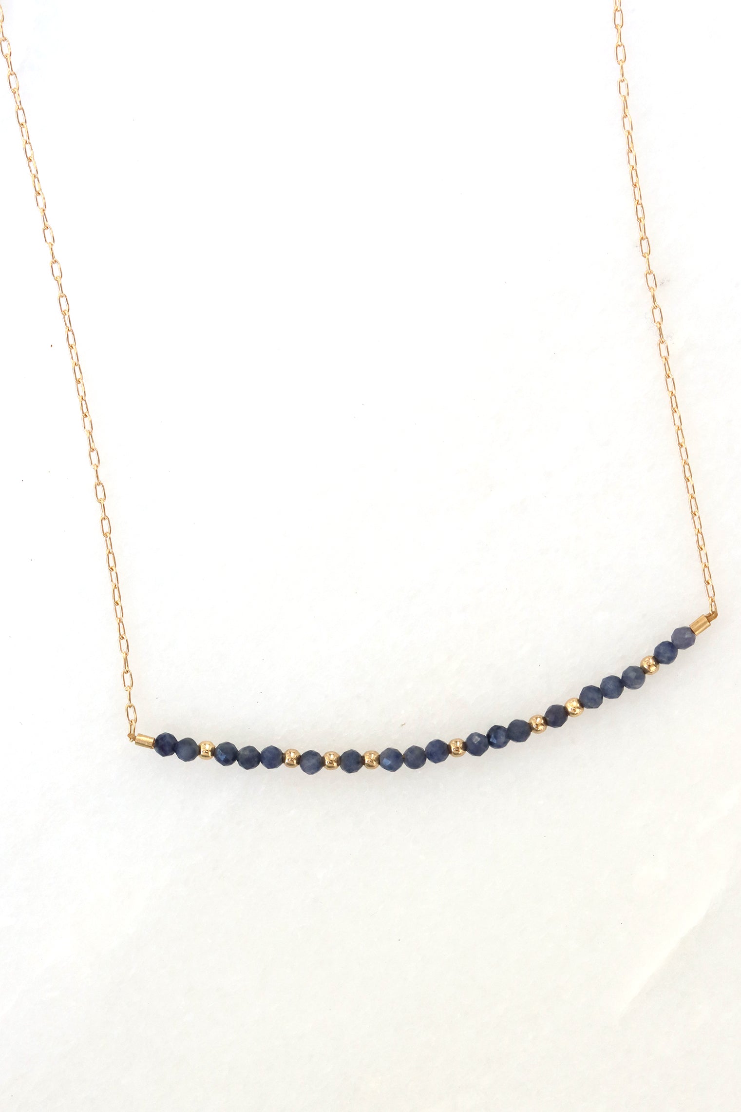 September birthstone bar necklace with sapphire beads on a gold filled chain.