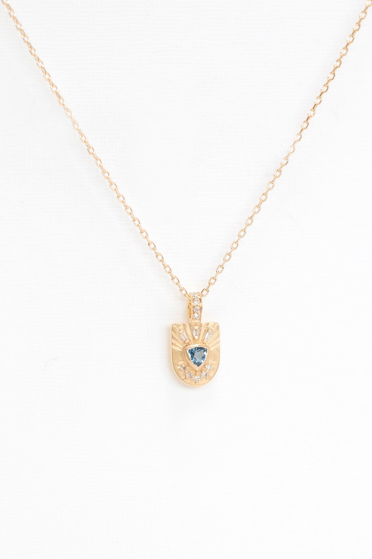 Close-up of the aquamarine and diamonds on the totem pendant by Celine Daoust