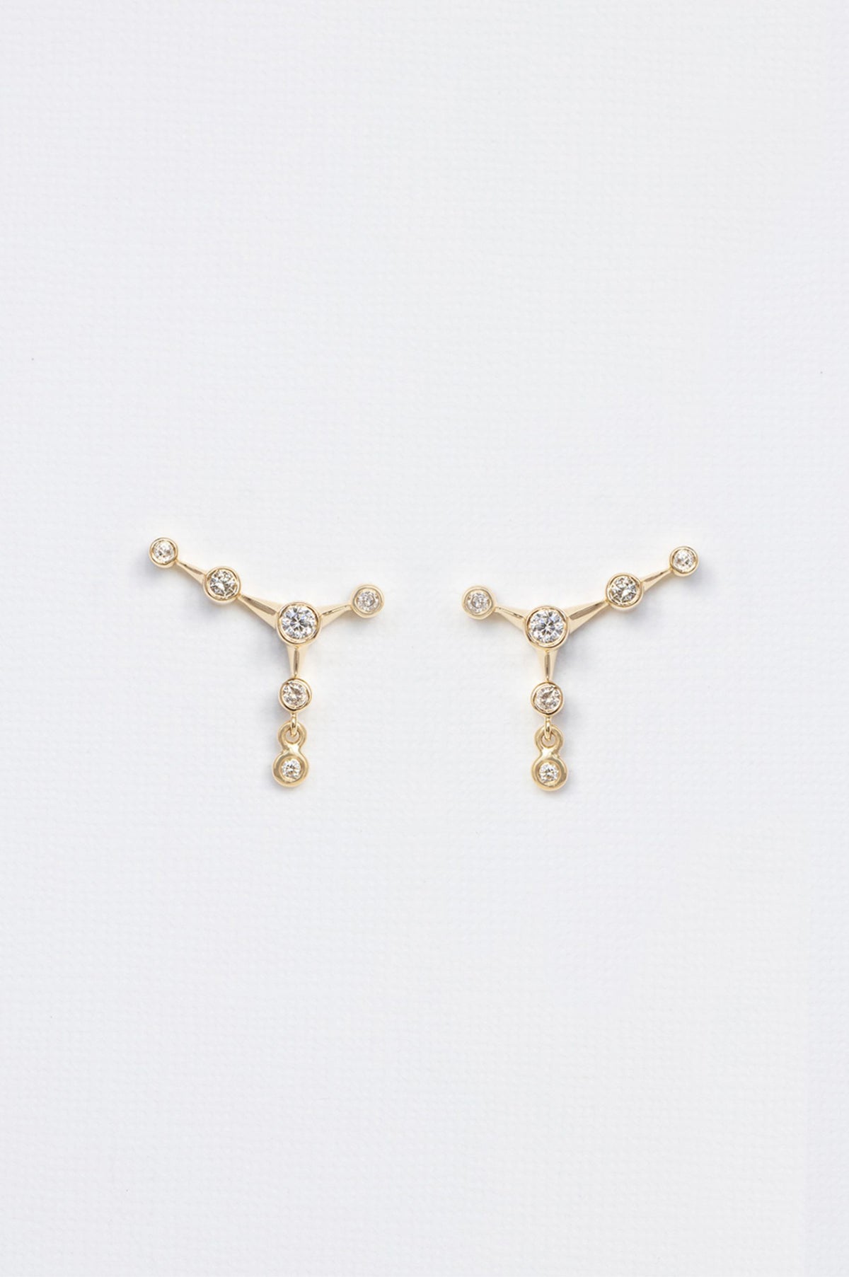 Diamond constellation stud earrings in 14k yellow gold by Celine Daoust.