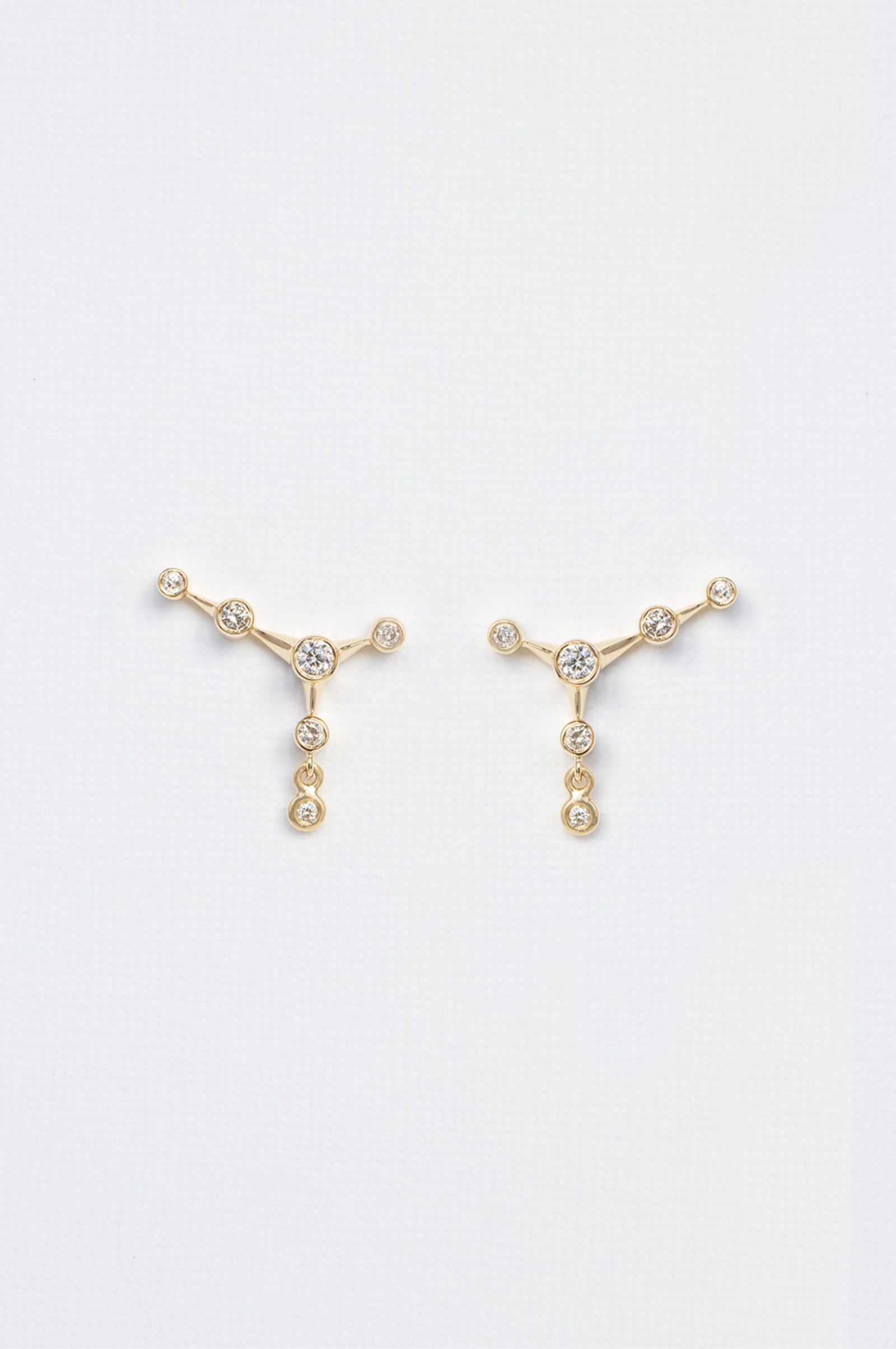 Diamond constellation stud earrings in 14k yellow gold by Celine Daoust.