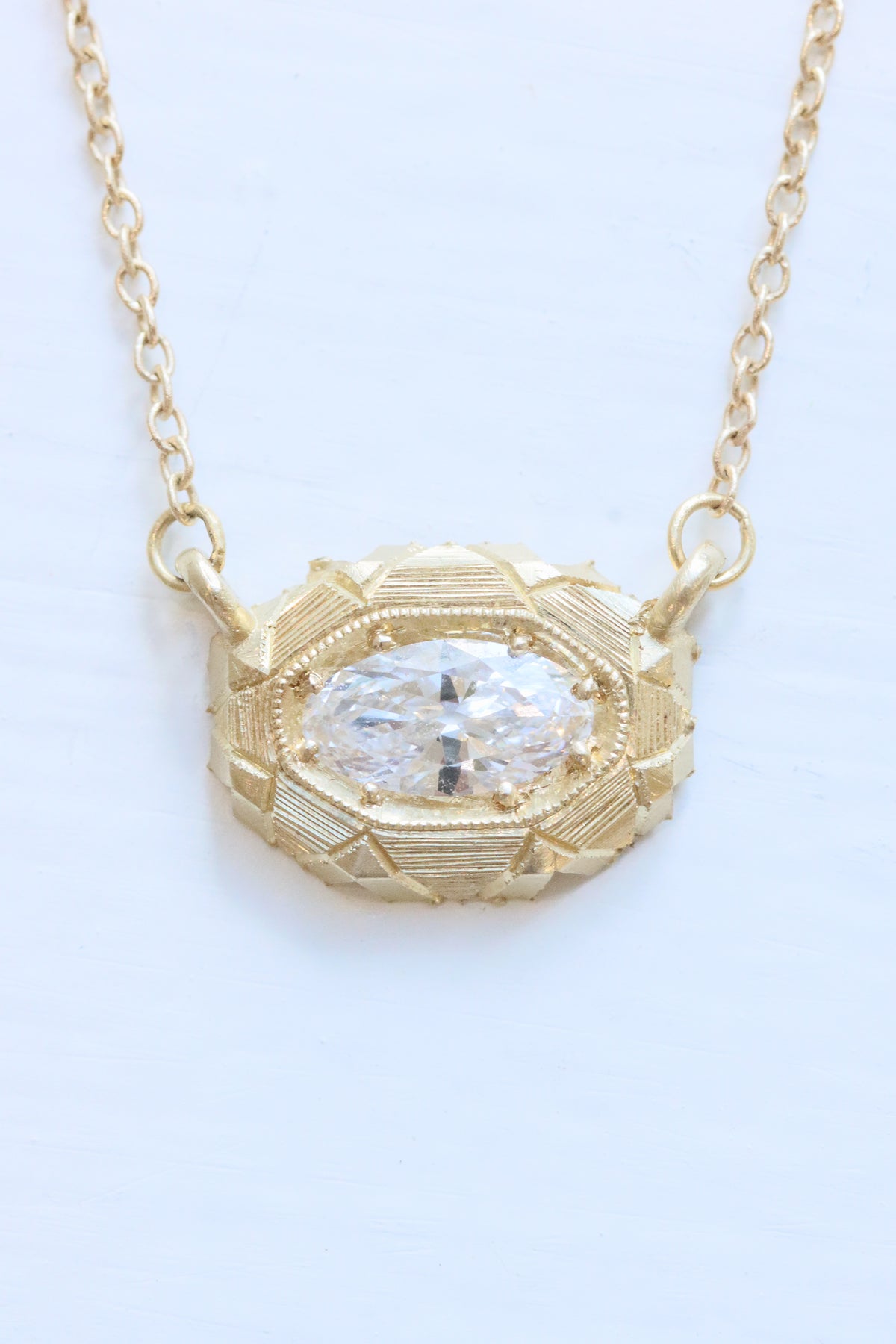 Torvi diamond necklace in 14k yellow gold by Erin Cuff.