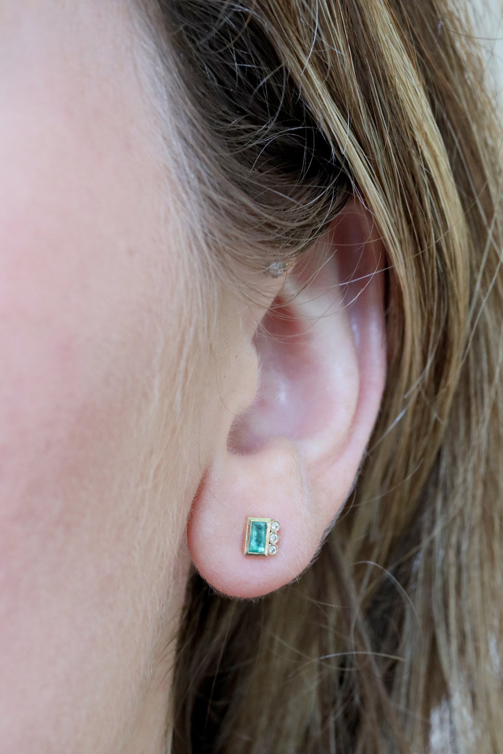 Emerald baguette and diamond single earring in 14k yellow gold by Celine Daoust.