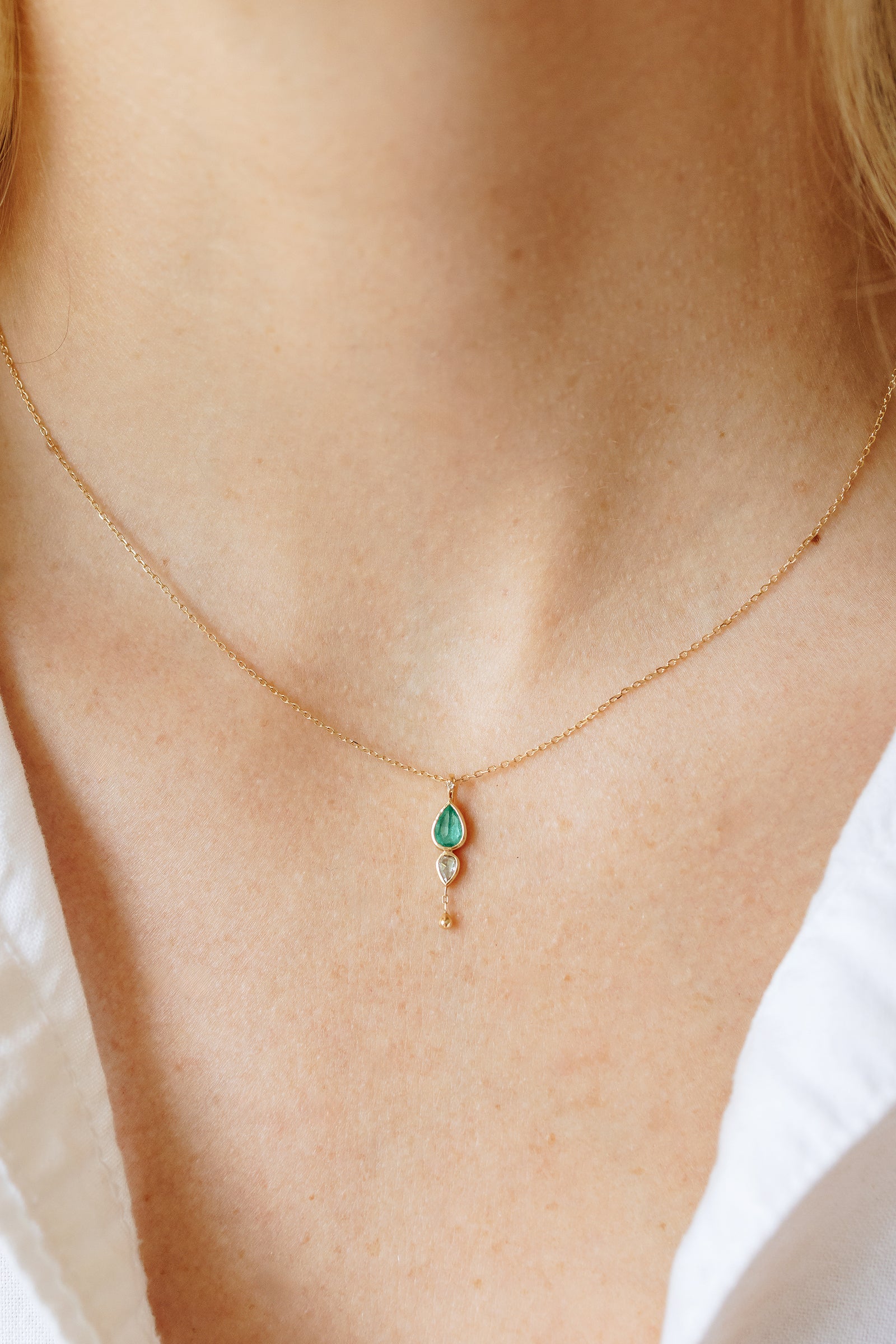 Celine Daoust emerald and grey diamond necklace with dangling detail in solid 14k yellow gold