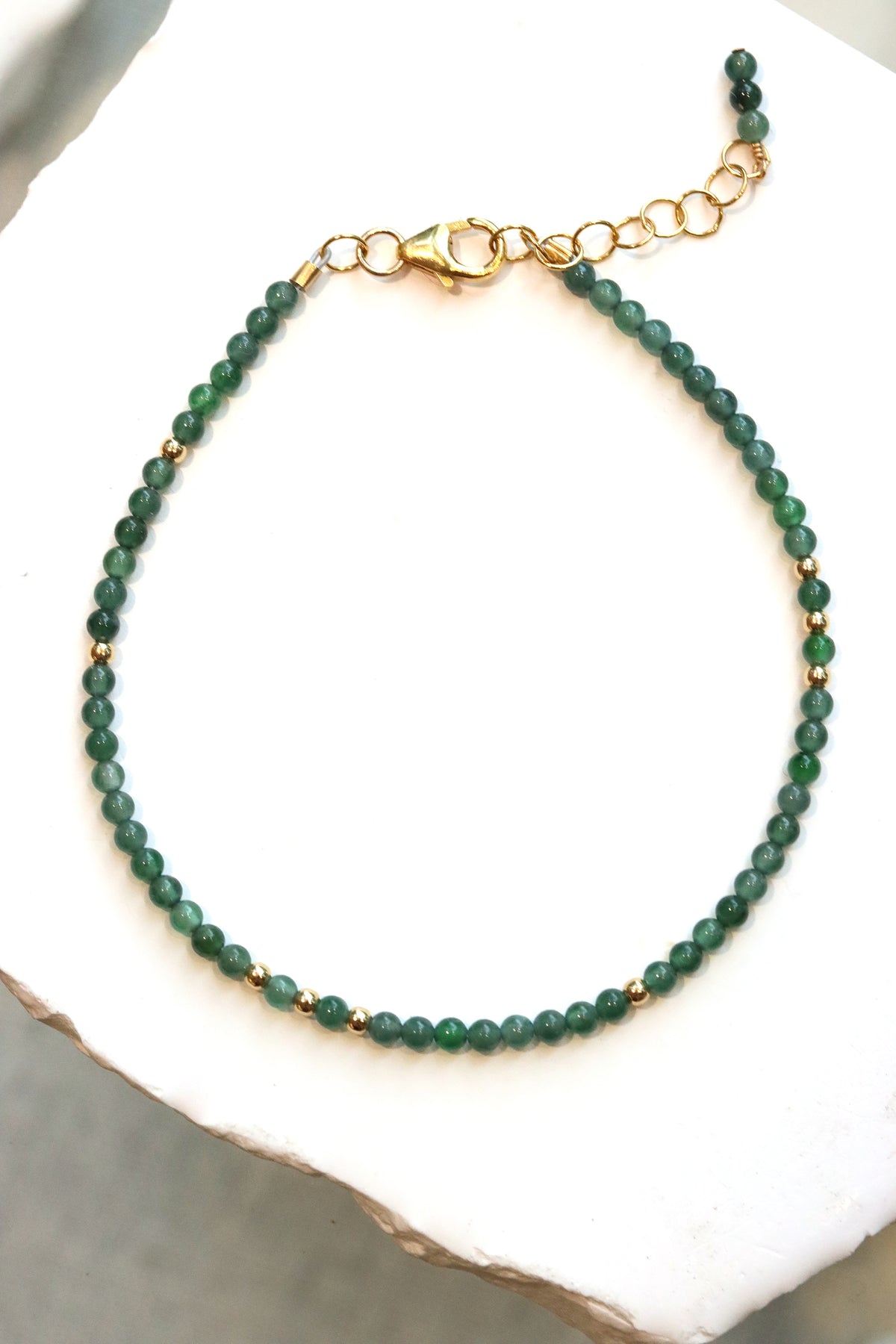 Jade Charm Bracelet with Guatemalan jade beads and gold accent beads on a gold chain clasp