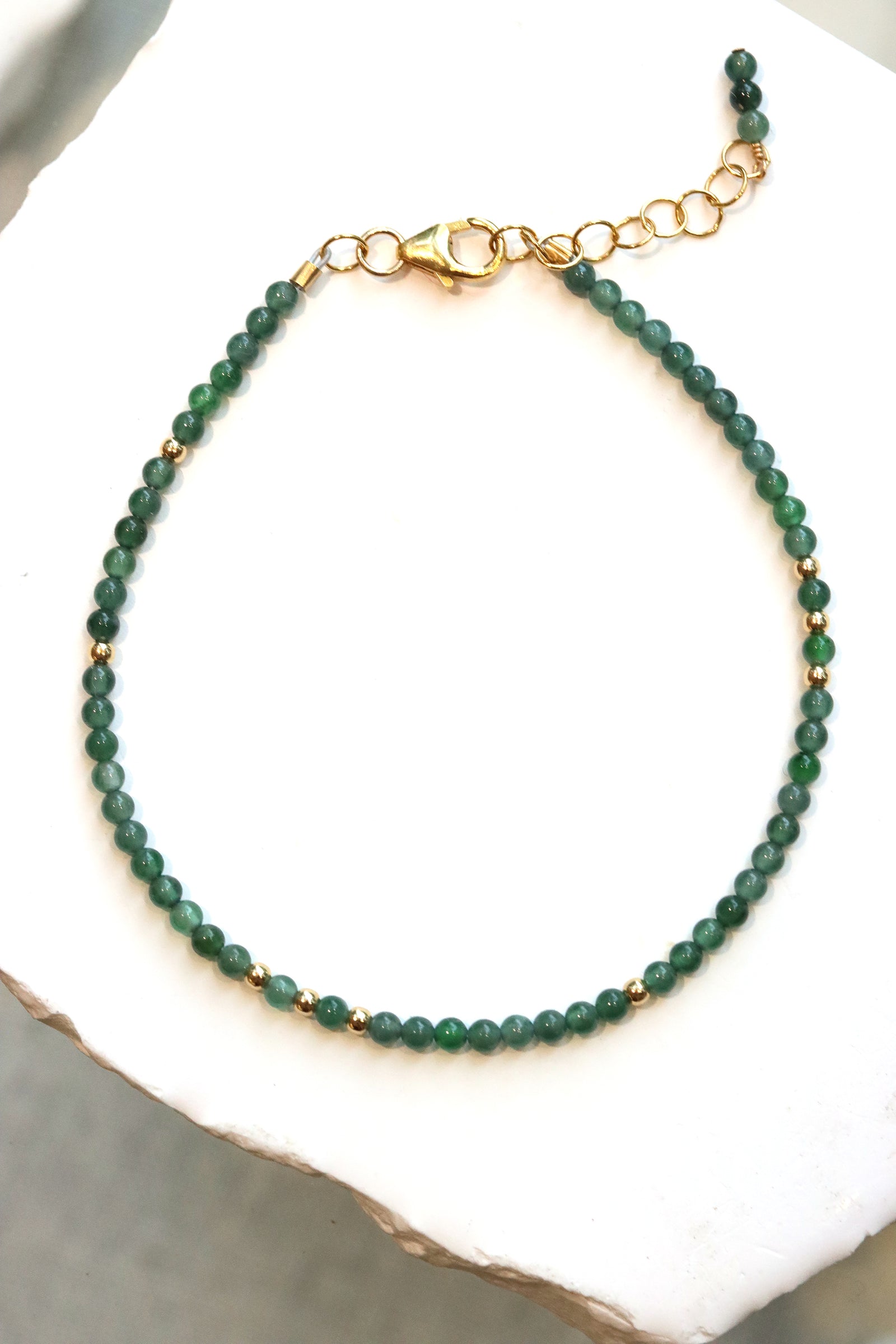 Jade Charm Bracelet with Guatemalan jade beads and gold accent beads on a gold chain clasp
