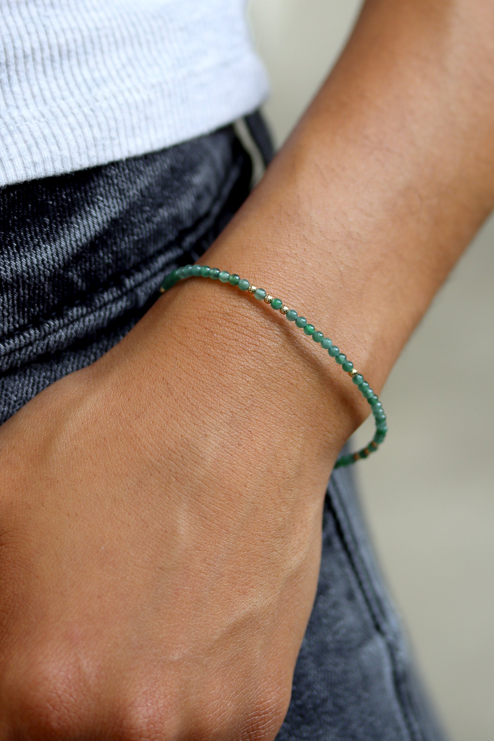 Jade Charm Bracelet with Guatemalan jade beads and gold accent beads on a gold chain clasp