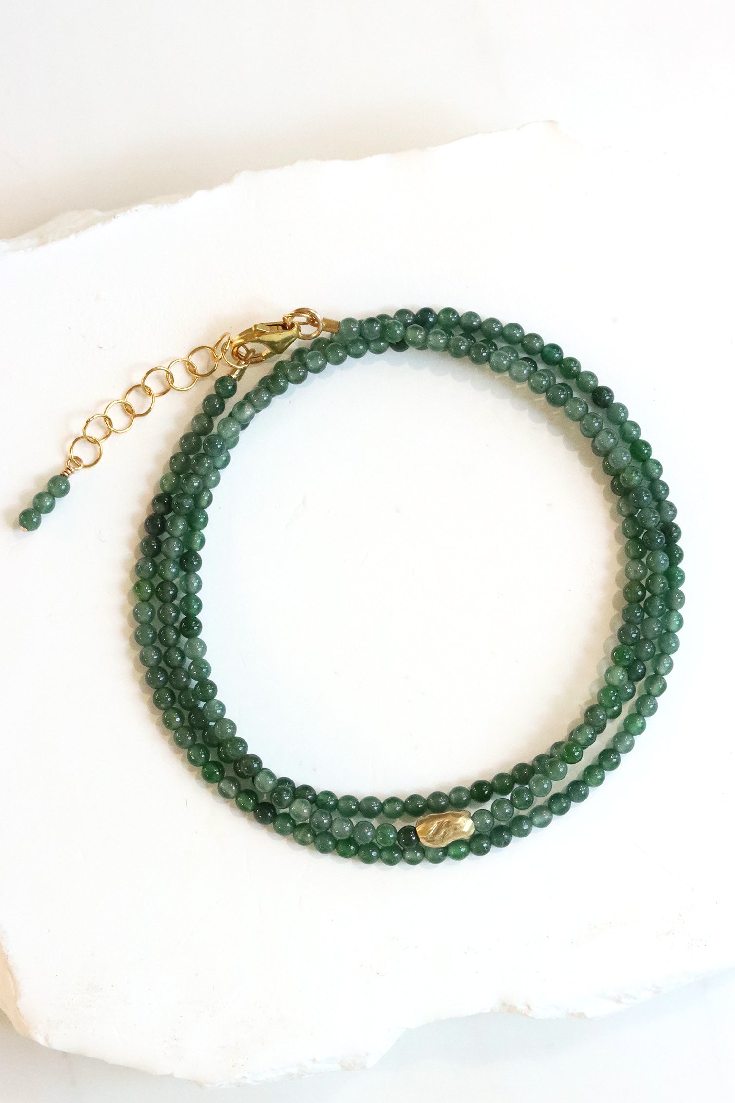 Jade Wrap Bracelet Necklace with Guatemalan jade beads and a gold accent bead, worn wrapped at the wrist