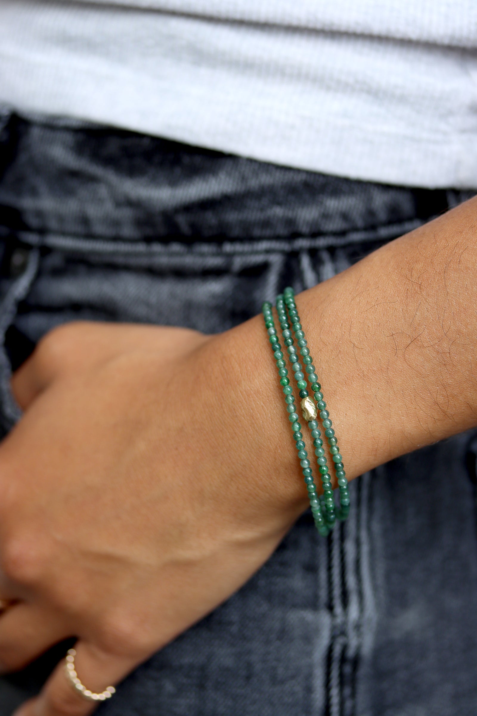 Jade Wrap Bracelet Necklace with Guatemalan jade beads and a gold accent bead, worn wrapped at the wrist
