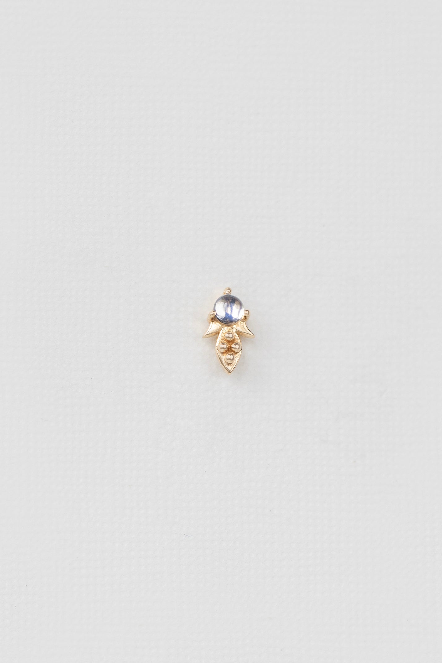 Rainbow moonstone single earring in 14k yellow gold with dot details by Celine Daoust.
