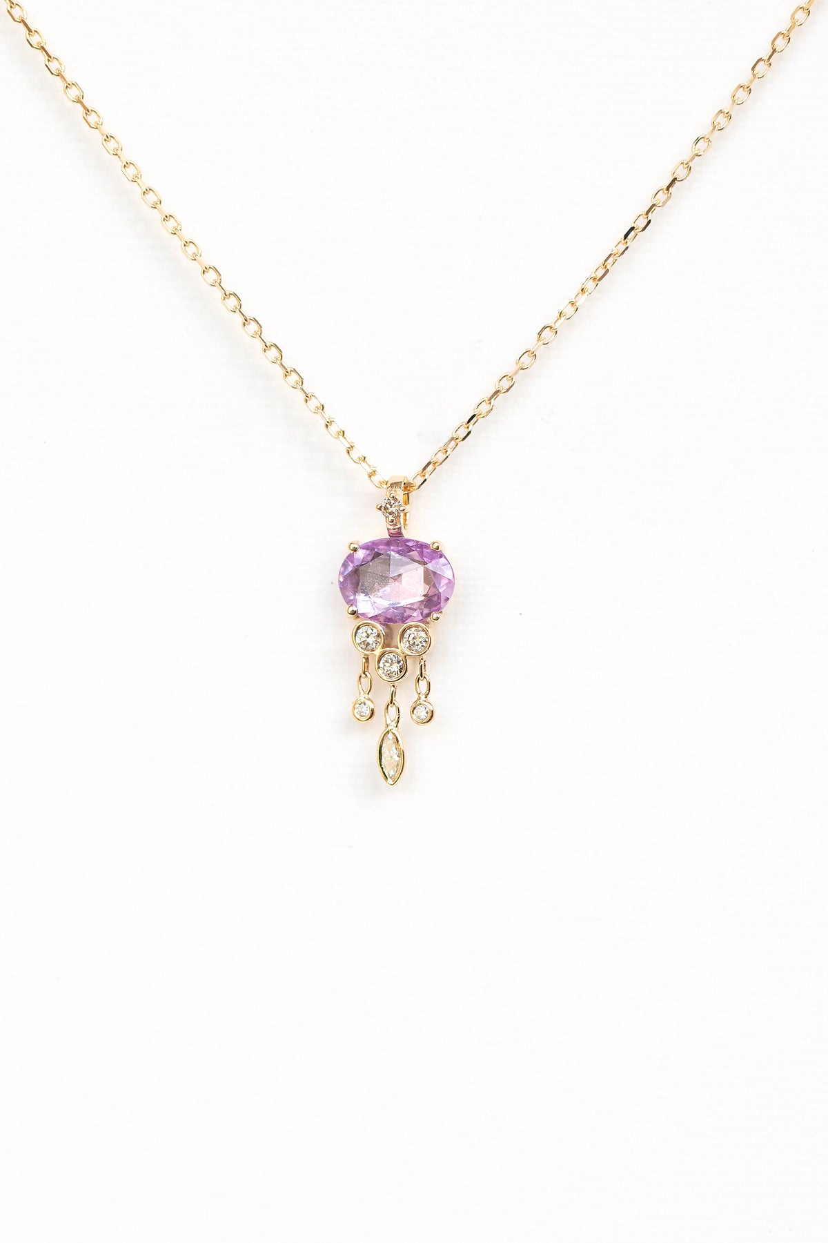 Pink sapphire and diamond jellyfish pendant necklace in 14k yellow gold by Celine Daoust."
