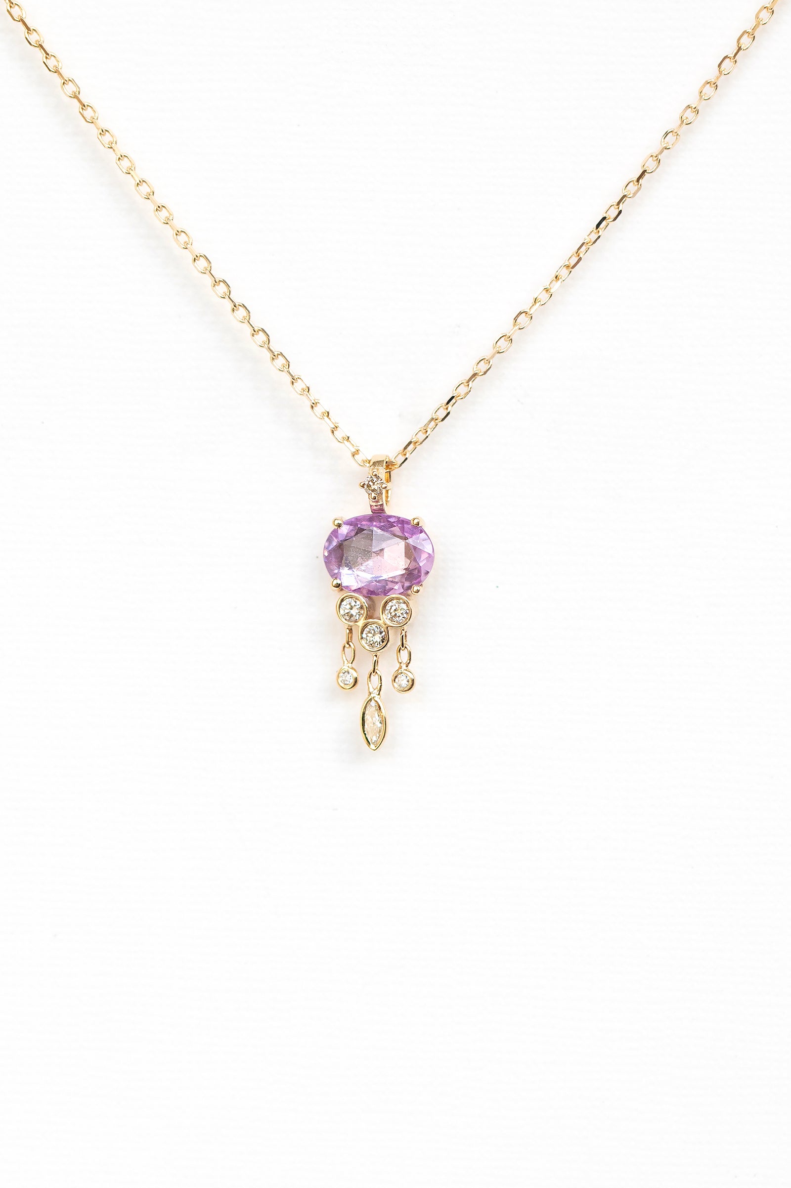 Pink sapphire and diamond jellyfish pendant necklace in 14k yellow gold by Celine Daoust."