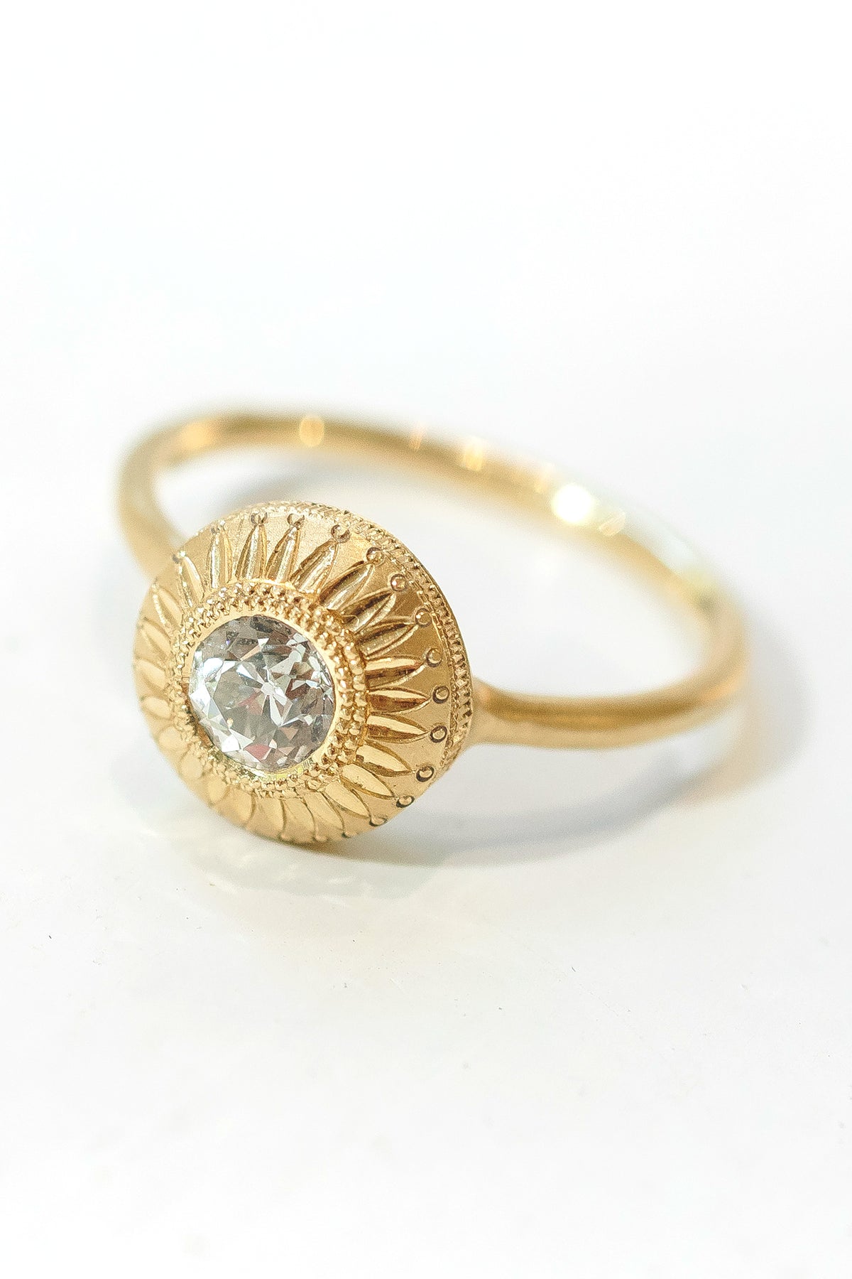Aurora Relic solitaire ring in 18k gold with an antique Old European cut diamond by Erin Cuff.