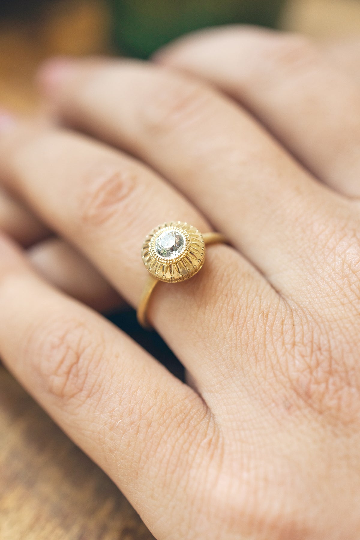Aurora Relic solitaire ring in 18k gold with an antique Old European cut diamond by Erin Cuff.