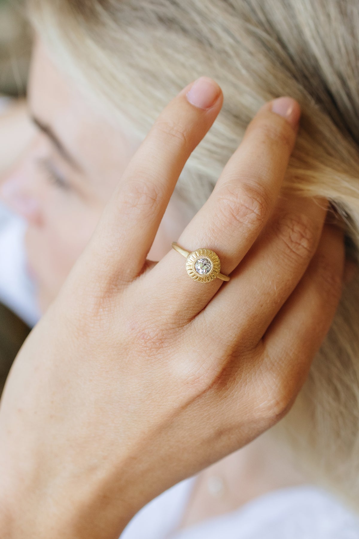 Aurora Relic solitaire ring in 18k gold with an antique Old European cut diamond by Erin Cuff.