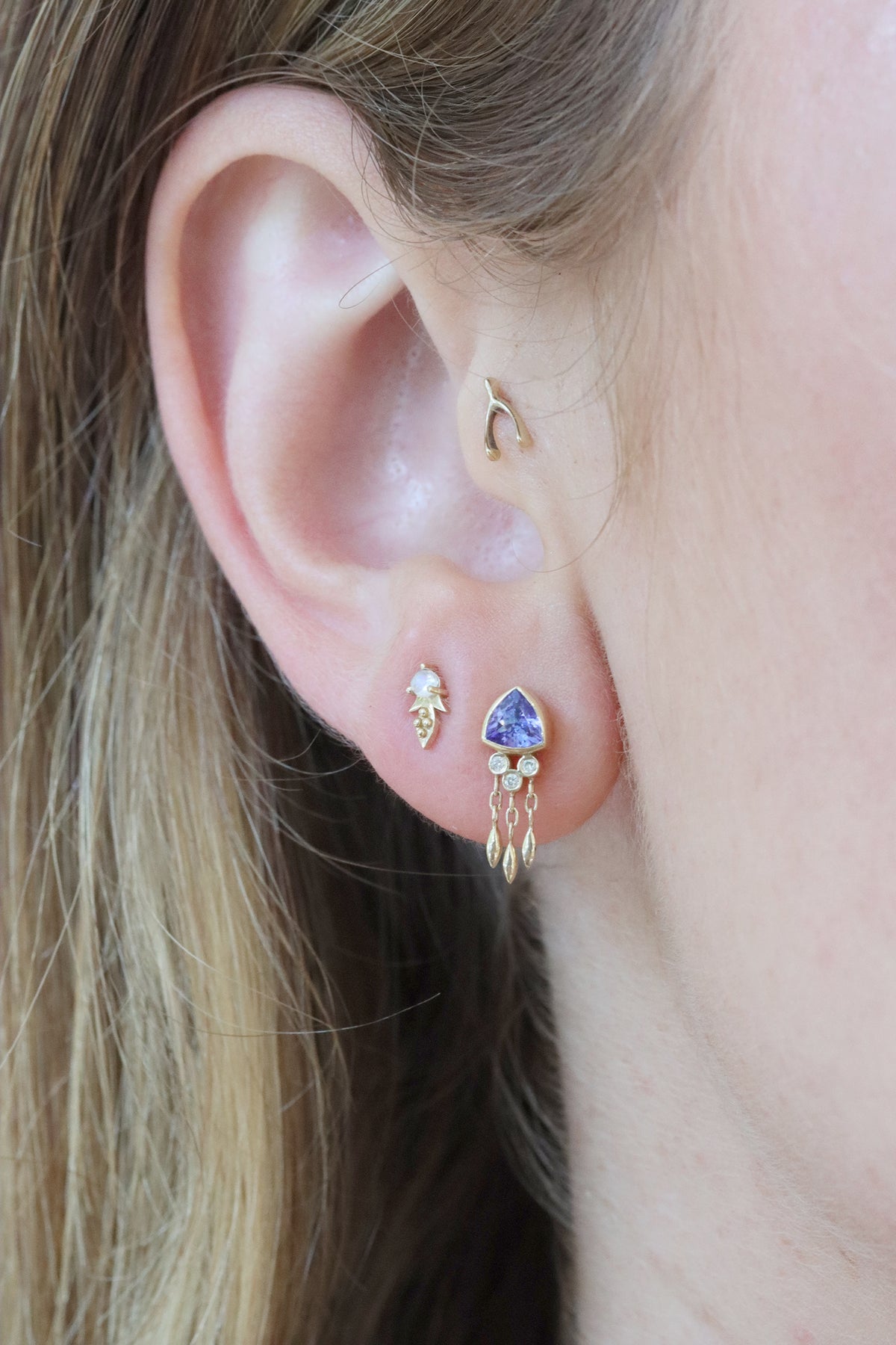 Triangle tanzanite and diamond single earring in 14k light yellow gold by Celine Daoust.