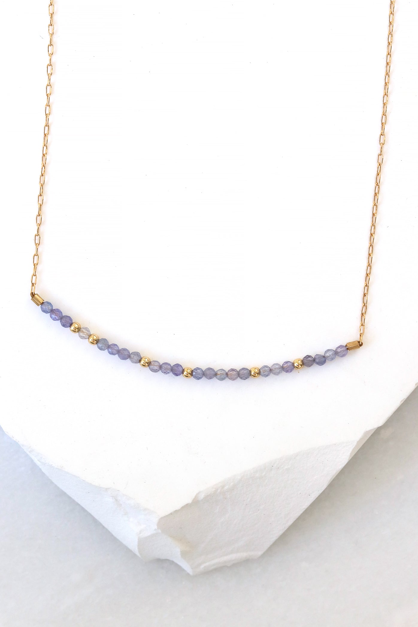 December birthstone bar necklace with tanzanite beads on a gold filled chain.