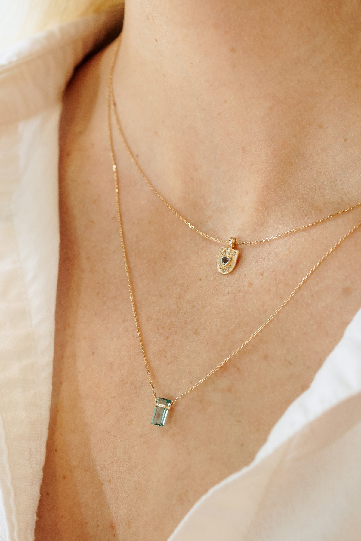 Close-up of the pencil-cut aqua tourmaline and baguette diamonds on the necklace by Celine Daoust