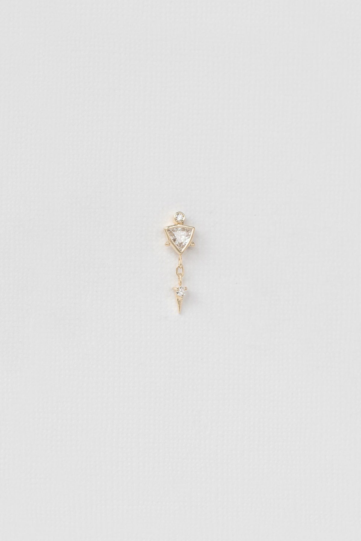 Diamond triangle single earring in 14k light yellow gold by Celine Daoust.