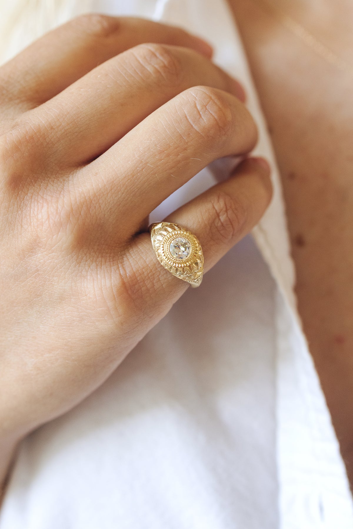 Tutta Volta solitaire ring in 18k gold with an old European cut diamond by Erin Cuff.